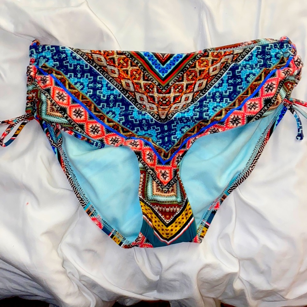 Medium bathing suit with tons of colors, cute and stylish , worn once on a cruis